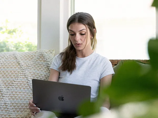 Woman Looking at Laptop Computer